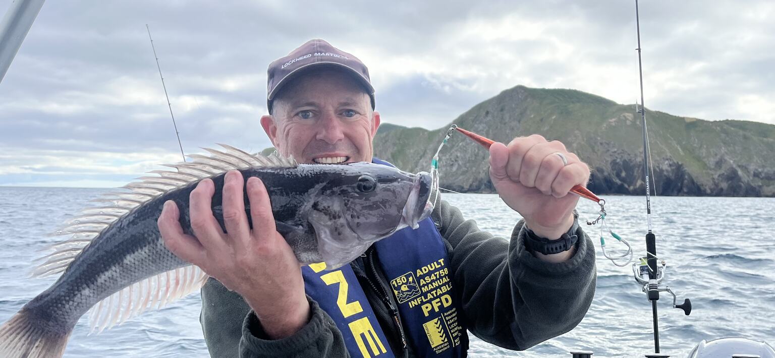 Paul holding a blue cod caught on a jig